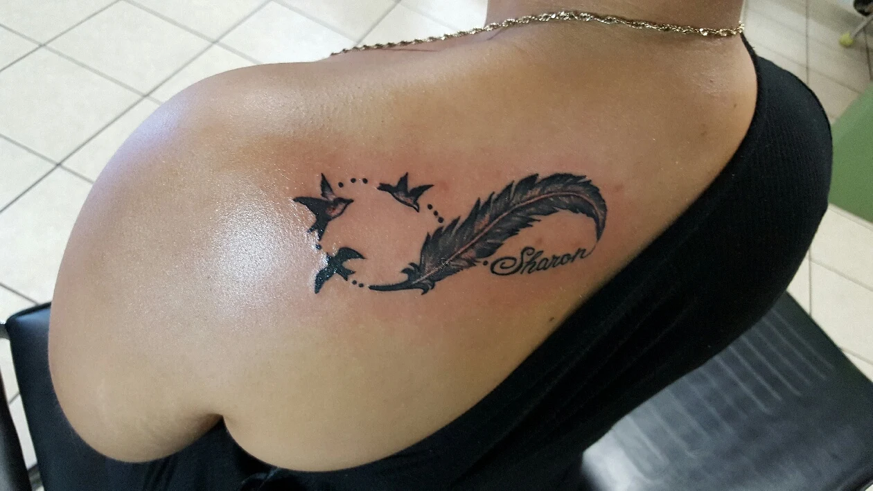 black-and-grey-feather-birds-tattoo-buford-ga